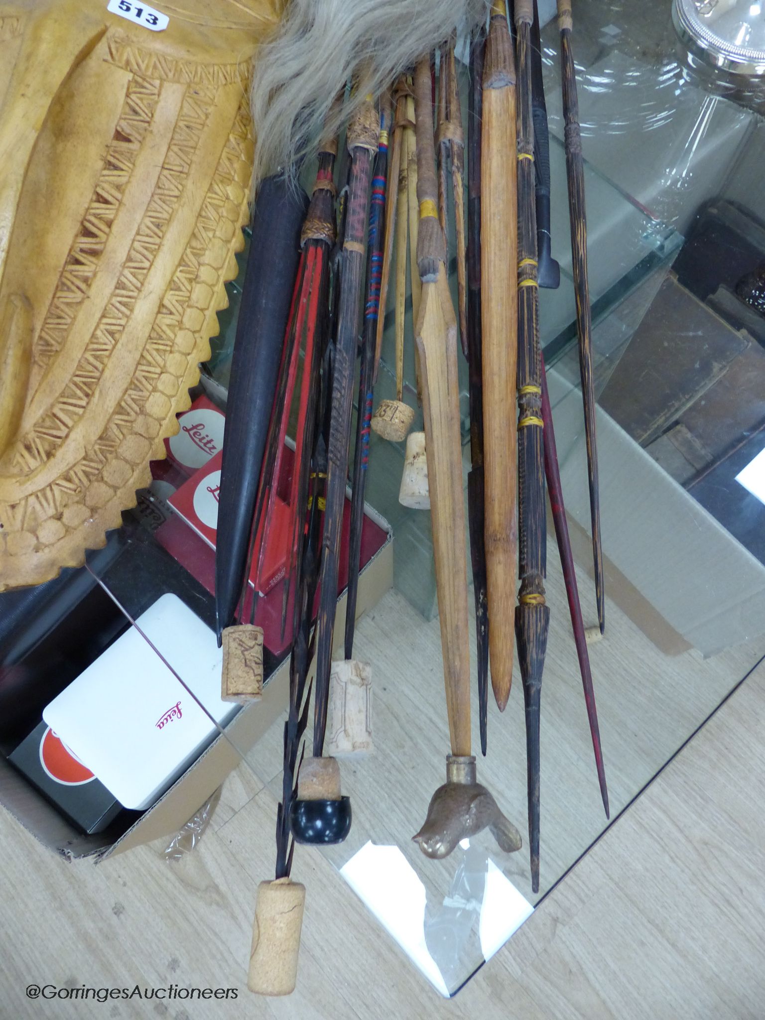 A collection of Tribal style spears etc and a mask
